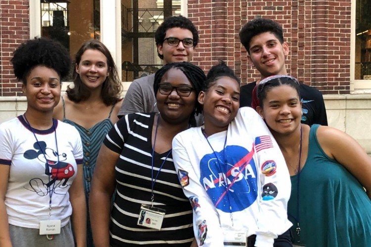 Freedom and Citizenship participants on Columbia's campus. A group of seven teenagers smiling at the camera.