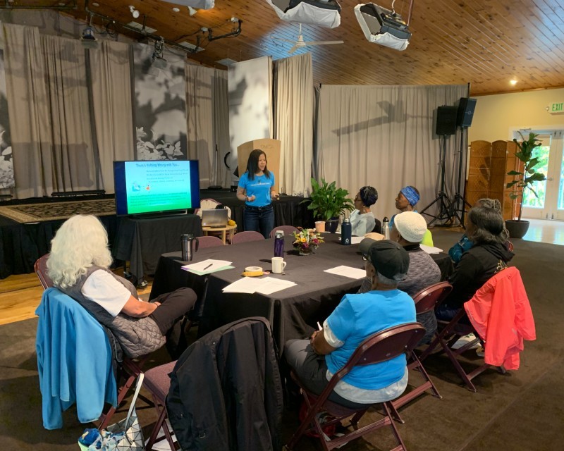 Harlem Wellness Center participants seated at conference to learn about healthy eating habits