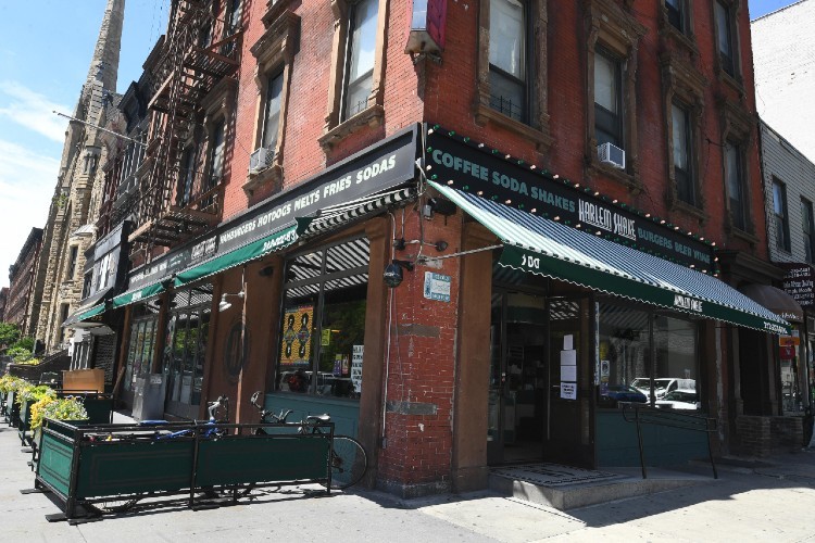 Pictured: Harlem Shake in the Heart of Central Harlem at 100 W. 124th St. (corner of Lenox Ave.) Photo by Eileen Barroso Picture of corner store front - harlem shake