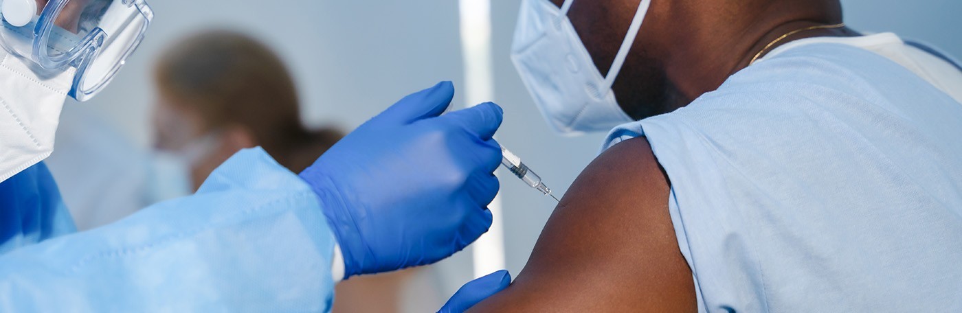 Healthcare worker receives a vaccine