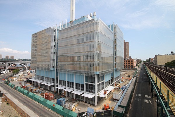 View of the Jerome L. Greene Science Center under construction, with the Riverside Drive viaduct in the background and the subway viaduct to the right.