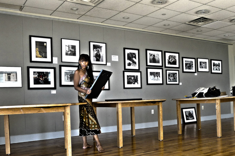 Curator Lisa DuBois at the 'Old Harlem, New Harlem' exhibition. Photo credit: Lisa DuBois
