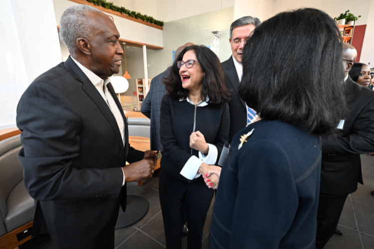 Minouche Shafik chats with Lloyd A. Williams, President and CEO of The Greater Harlem Chamber of Commerce. Photo credit: Eileen Barroso