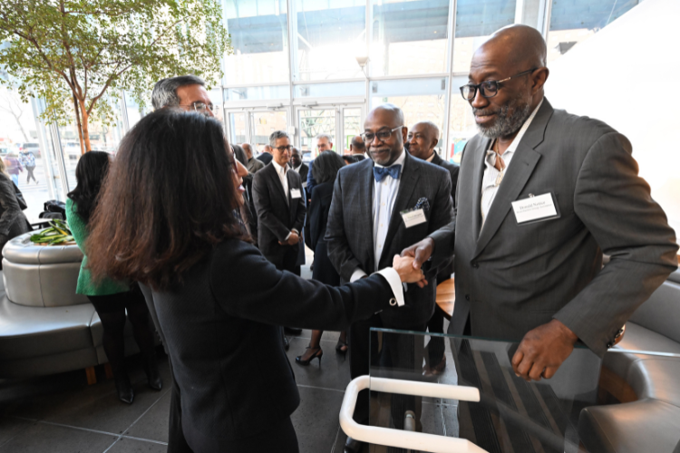 Shafik connects with Donald Notice, Executive Director, West Harlem Local Development Corporation, and Hamil Douglas, President & CEO, Harlem Commonwealth Council, at the Manhattanville Market breakfast reception. Photo credit: Eileen Barroso