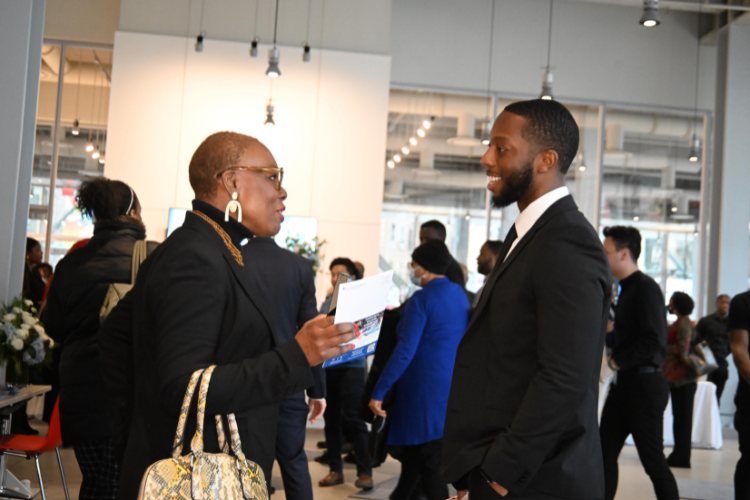 Attendees mixed and mingled at Columbia's annual Friends and Neighbors Breakfast. Image by Eileen Barroso.