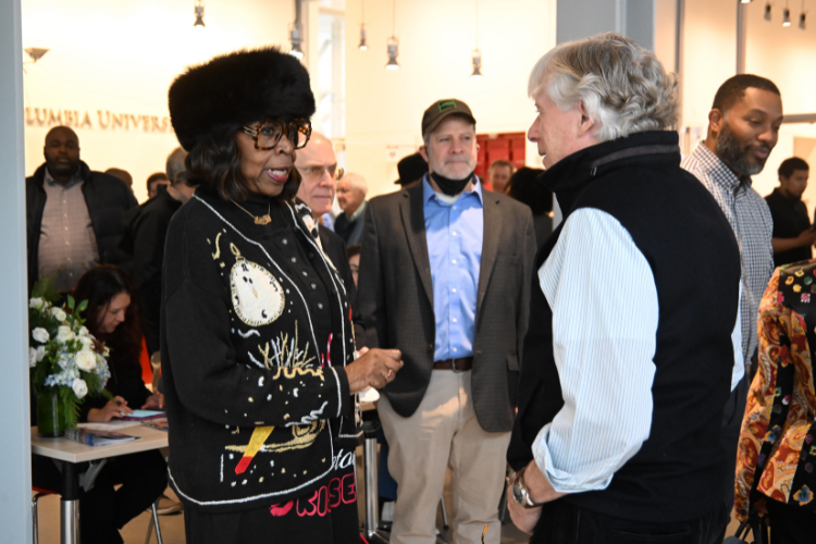 Columbia University President Lee C. Bollinger connected with attendees at the annual Friends and Neighbors Breakfast. Image by Eileen Barroso.