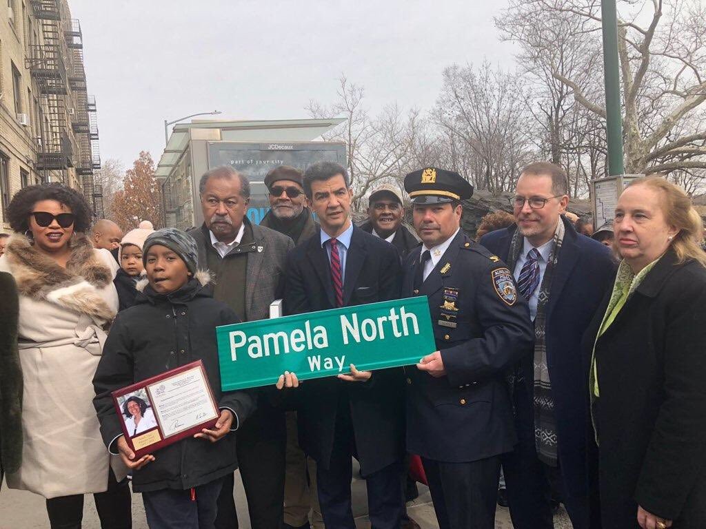 Photo of Ydanis Rodriguez and others presenting the new street sign. (Photo courtesy of Office of Council Member Ydanis Rodriguez)