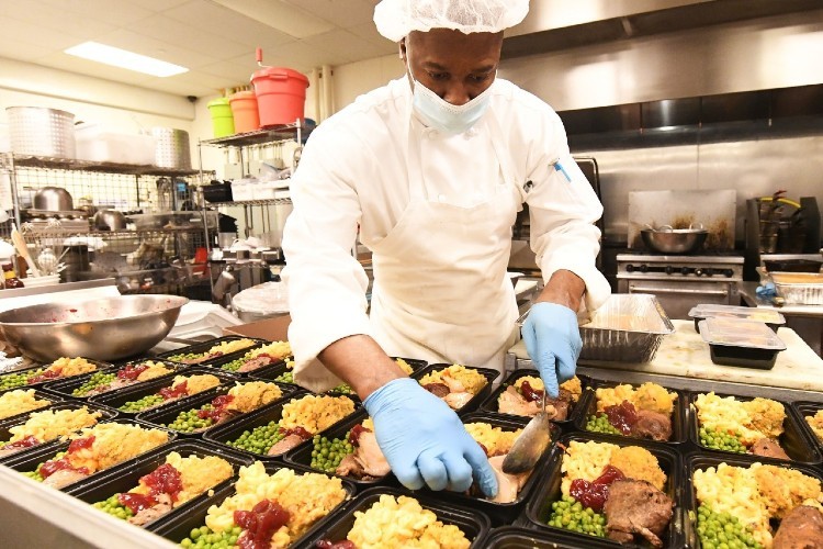 Chef Cornel of Cornel’s Catering Company at Hot Bread Kitchen in East Harlem preparing 150 pre-Thanksgiving meals for local senior citizens. Photo Credit: Eileen Barroso