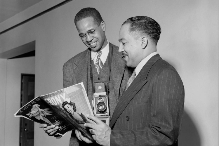 Langston Hughes and Griffith J. Davis looking through the pages of Ebony Magazine. Photo credit: Griffith J. Davis Photographs and Archives