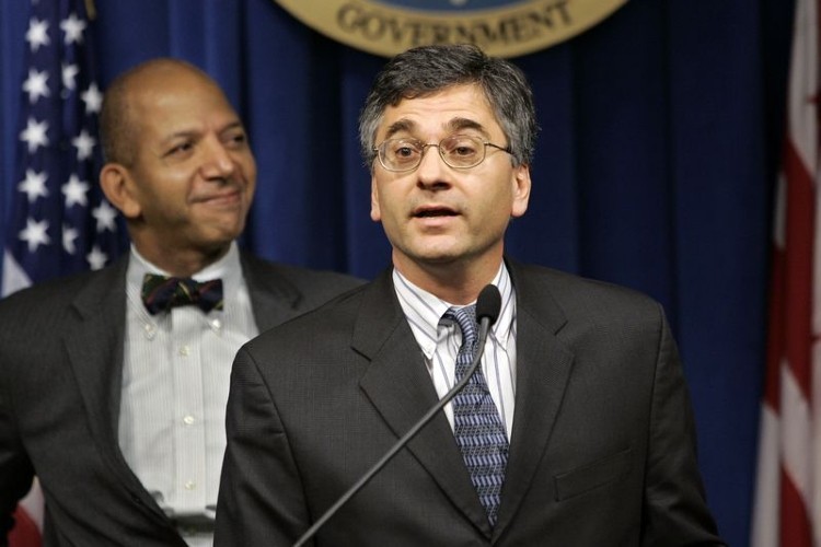 In this file photo, Vincent Schiraldi, right, speaking during his weekly press briefing at the Wilson Building in Washington, on Dec. 15, 2004. (J. SCOTT APPLEWHITE/ASSOCIATED PRESS)