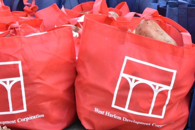Red Bags of food with WHDC logo on bag. 