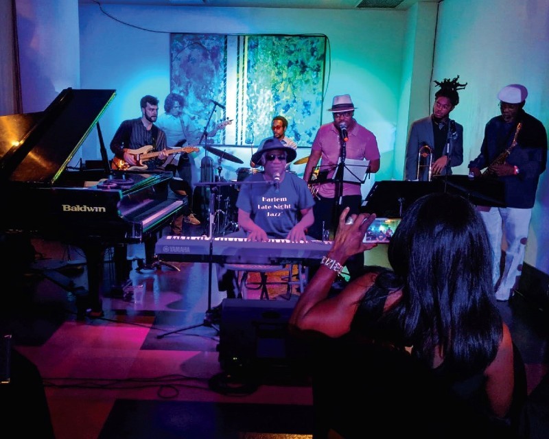 Jazz musician Frank Lacy performing at the MIST Harlem for the Harlem Jazz & Music Festival. Photo Credit: West Harlem Development Corporation Jazz musicians on stage performing
