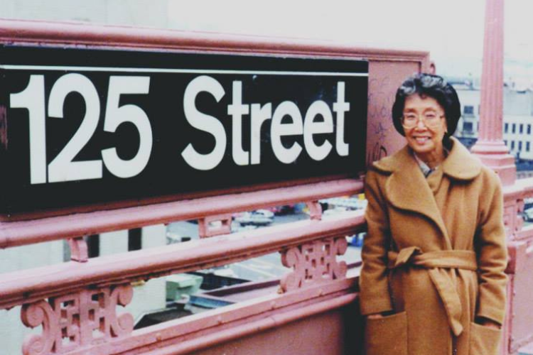 Kochiyama at the elevated 125th Street and Broadway train station near Manhattanville Houses. Photo credit: Remembering Yuri Kochiyama Facebook