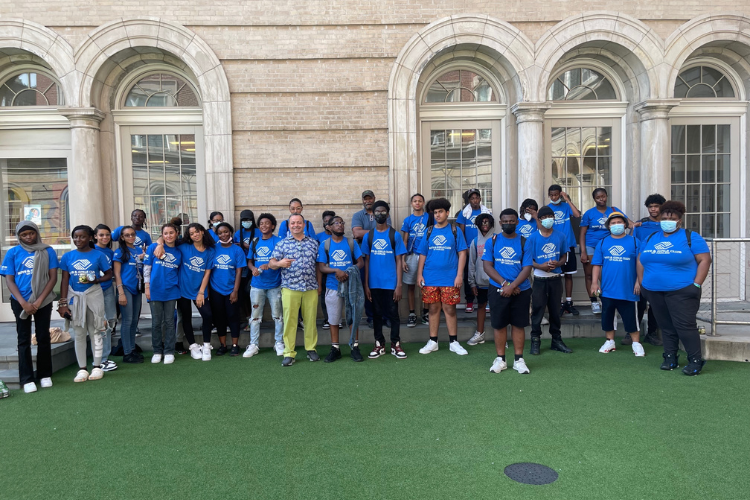 Zead Ramadan, Executive Director, West Harlem Development Corporation, with youth from the Boys and Girls Club of Harlem.