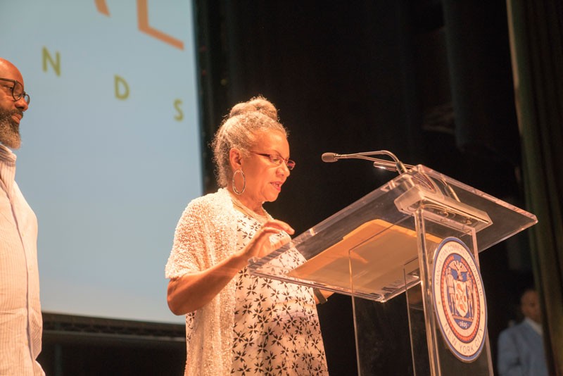Photo Credit: Lynn Saville Speakers at podium