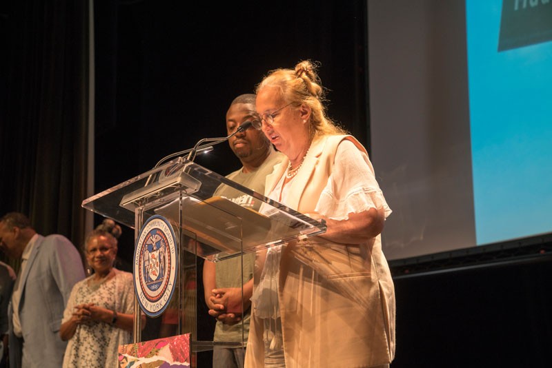 Photo Credit: Lynn Saville Speakers at podium