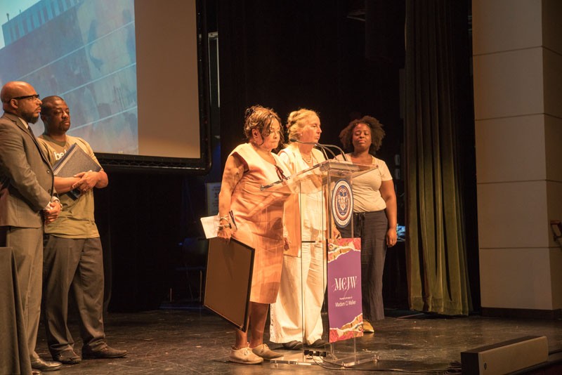 Photo Credit: Lynn Saville Speakers at podium