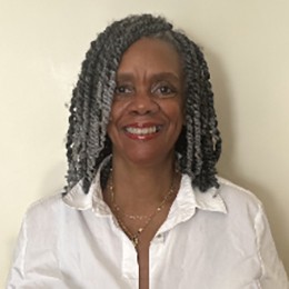 Bonita LloydNettles A woman with gray hair looks into the camera smiling.
