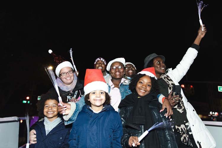 Festive riders on the Columbia float at the Harlem Holiday Lights parade.