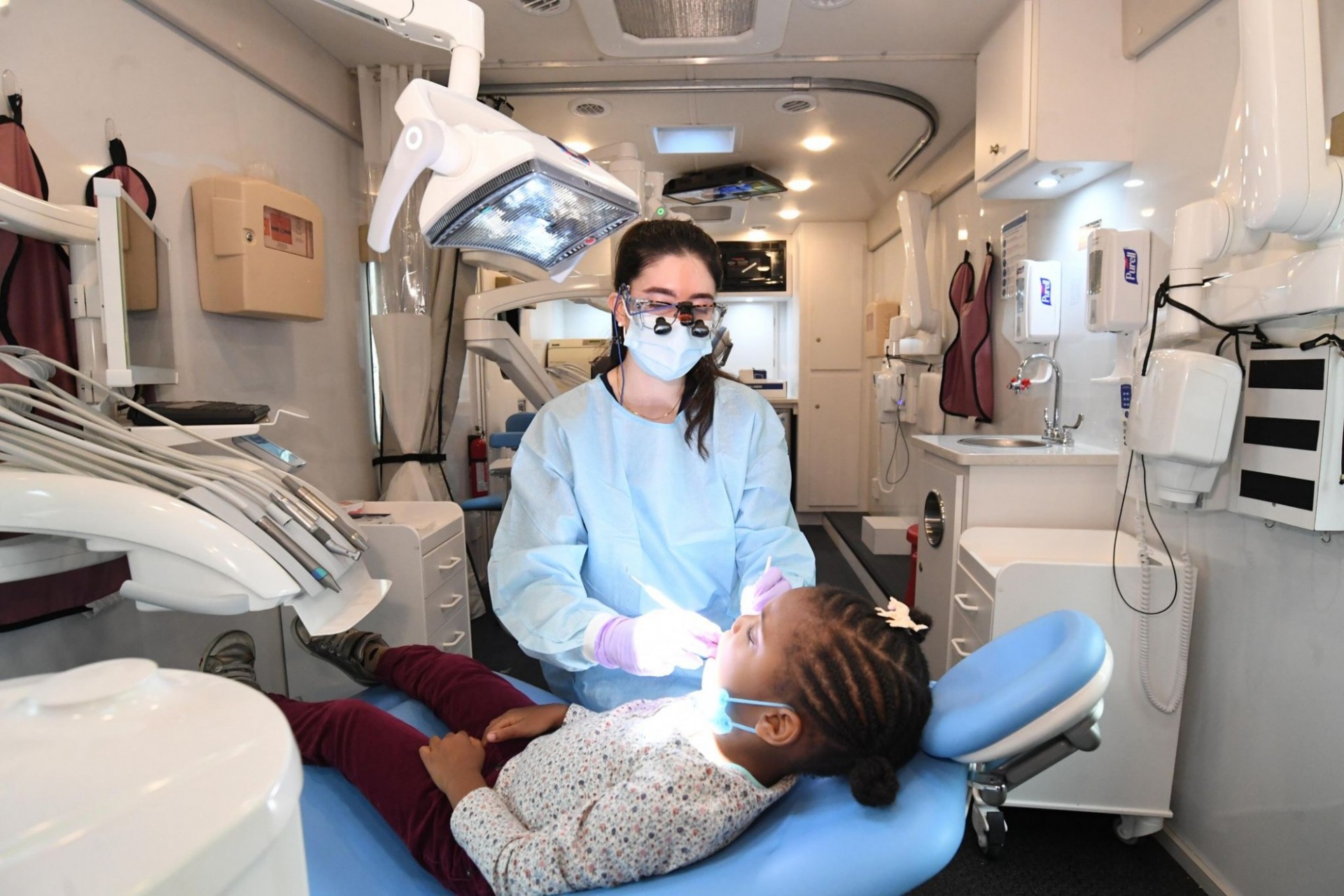 A dental procedure is undertaken in the mobile dental van. 