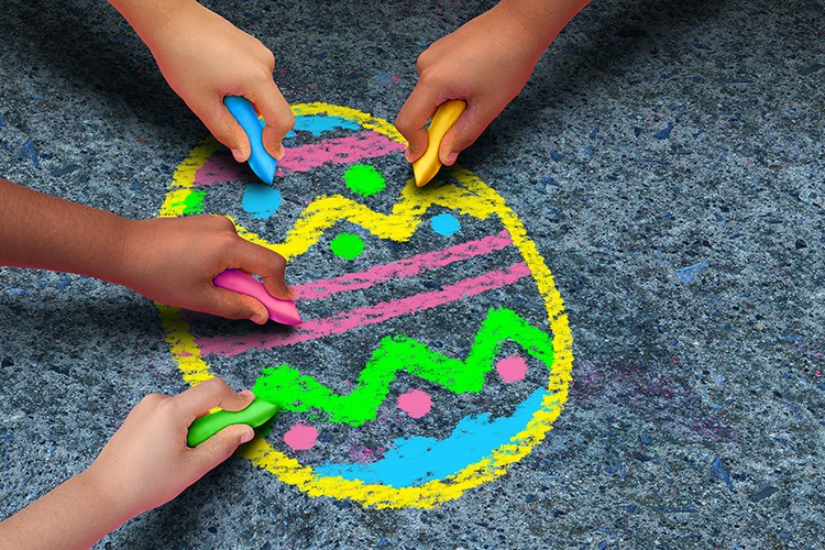 children hands coloring easter egg