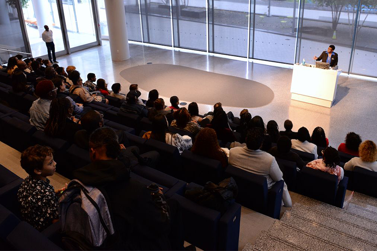 Pat Lilly, Senior Program Manager at Columbia Business School, welcomes First Generation Entrepreneurs Program graduates and their friends and families in David Geffen Hall on Columbia's Manhattanville campus. Photo by Leslye Smith. Pat Lilly addresses a crowd