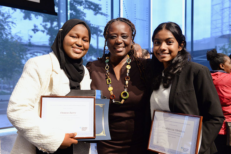 Students pose with Senator Cleare after the ceremony.