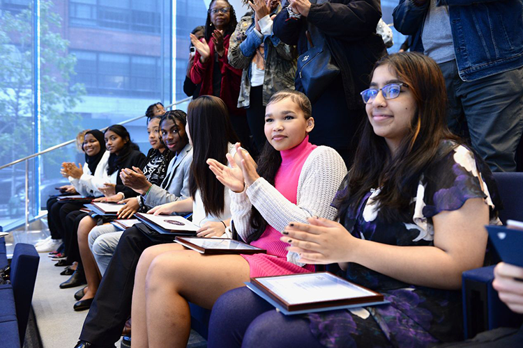 Friends and family applaud graduates of the First Generation Entrepreneurs Program. Photo by Leslye Smith. Graduates of the First Generation Entrepreneurs Program.