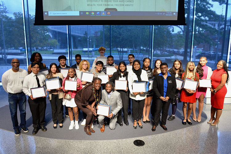 Graduates of Columbia University's First Generation Entrepreneurs Program pose alongside program administrators, teachers, and Senator Cordell Cleare at a graduation ceremony for the second cohort of students to go through the program. Photo by Leslye Smith. SBDC Graduation