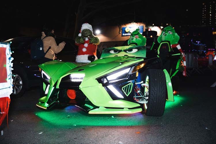 And, finally, a grinch-mobile to make you smile during the Harlem Holiday Lights Parade. Photo by Kevin Dale Photography. A grinch-decorated car in the Harlem Holiday Lights Parade.