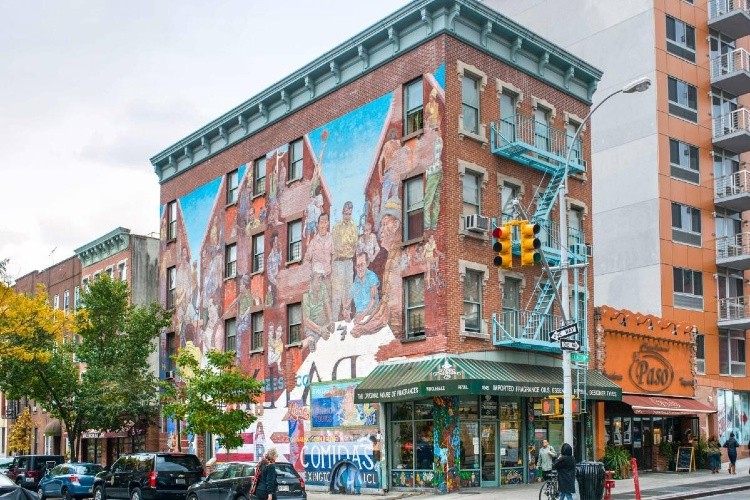 Image of building with artist mural for harlem ren 100