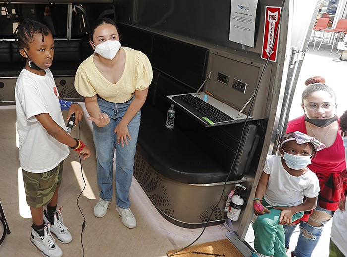 Two people inside of the BioBus.