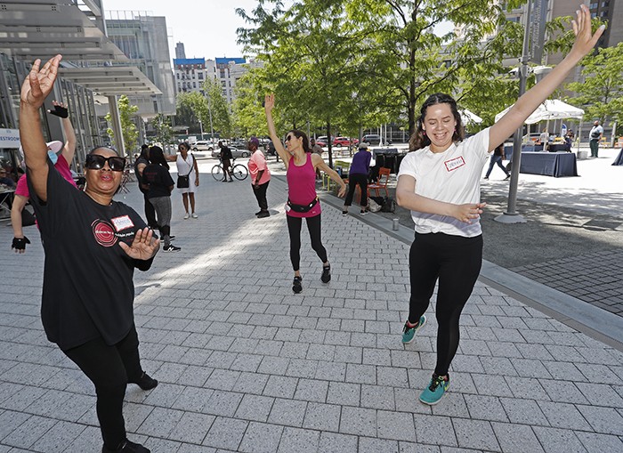 Dances for a Variable Population performs in The Plaza. Photo by Lou Rocco. People dance on Manhattanville campus.