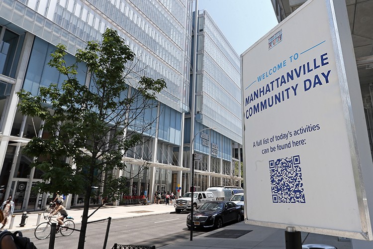 Community Day returned to Columbia's Manhattanville campus on Saturday, May 21, 2022 for the first time since the start of the pandemic. Photo by Lou Rocco. A sign reading "Welcome to Manhattanville Community Day" outside of Lenfest Center for the Arts.