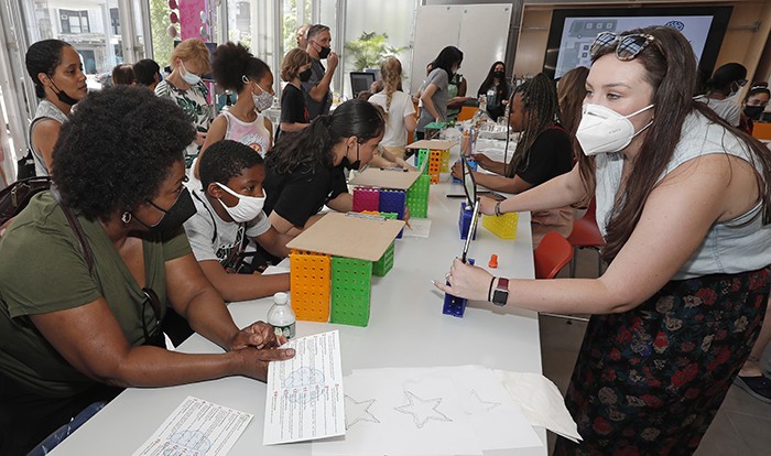 Children and parents in the Education Lab at Jerome L. Greene Science Center. 