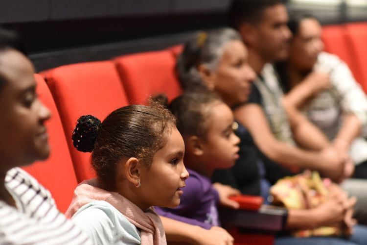 Manhattanville Community Day attendees enjoying a film at Lenfest Center for the Arts.