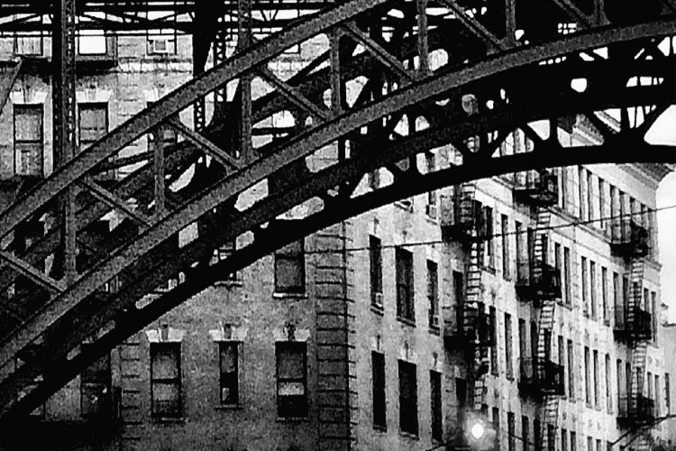 black and white image of arch on 125th street under the train