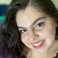 A headshot of a woman smiling at the camera.