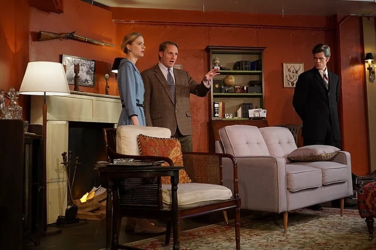 Tess Frazer, Brandon Schraml and Steve Bauder from The Morningside Players perform The Unexpected Guest. Three people standing in a furnished room performing a play