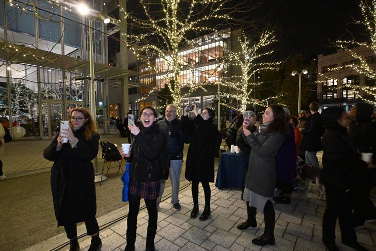 Lights on the Plaza attendees "ooh" and "aah" at the lighting of the trees on the plaza. Photo by Eileen Barroso. Lights on the Plaza attendees "ooh" and "aah" at the lighting of the trees on the plaza.