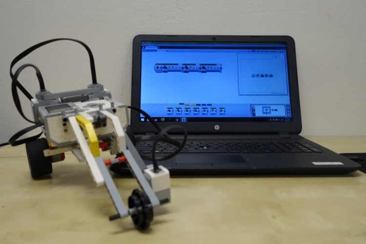 A robotics project at Robofun. Photo courtesy of Laura Hart. A small robot in front of a computer