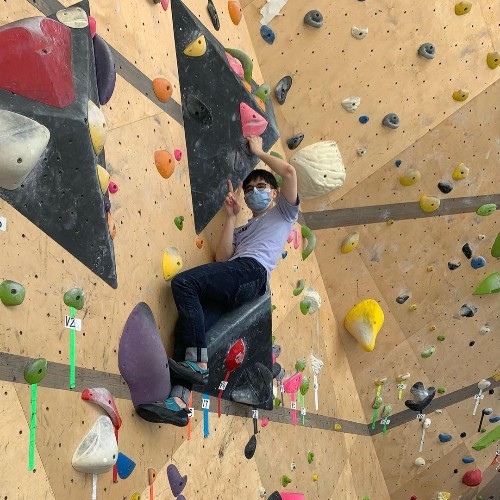A child climbing a wall at The Vital Climbing Gym, formerly known as Steep Rock Bouldering, in Manhattanville.