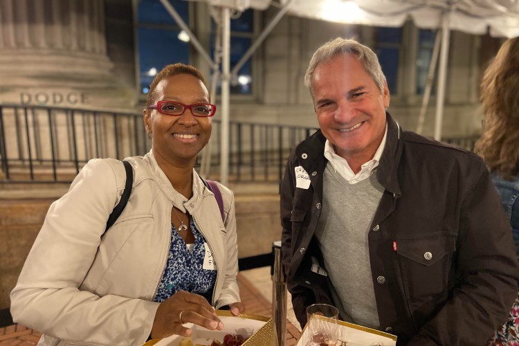 2 people smiling at the camera