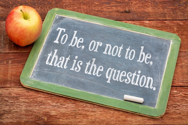 A slate that says "To be, or not to be, that is the question."