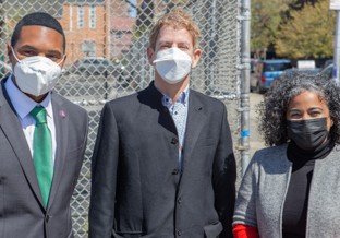 Left to right: Rep. Richie Torres, Prof. Peter Muennig, Assemblywoman Karines Reyes. Three adults wearing masks standing outside.