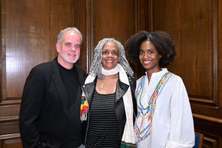 One man and two women pose for a photo, looking at the camera. 