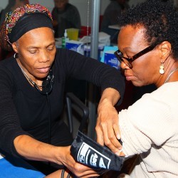 A woman receives blood pressure screening at the Wellness Center.