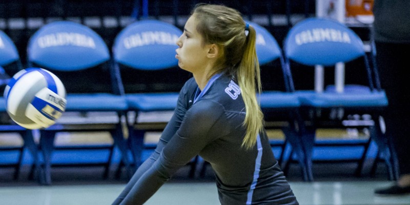 woman hitting a volleyball