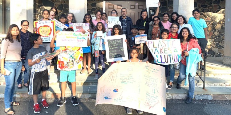 Children gathered for group picture with signs