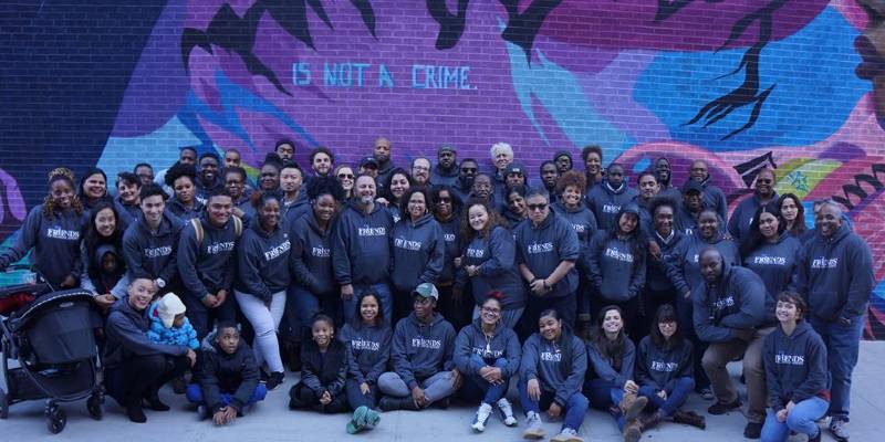A large group of people in matching Friends of Island Academy sweatshirts.